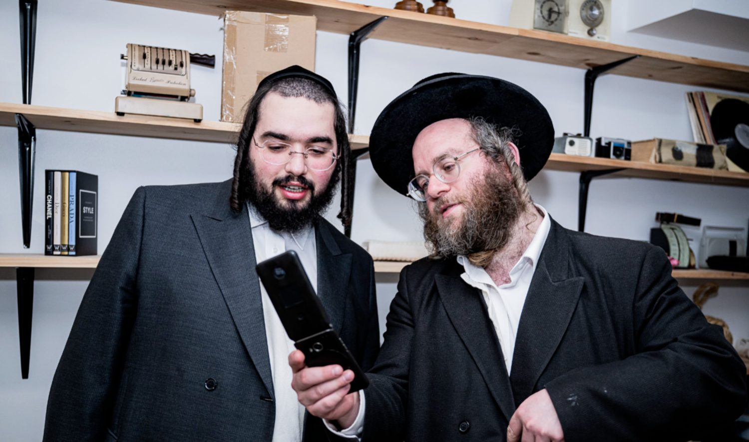 Two Ez Cloud team members reviewing something together in the office